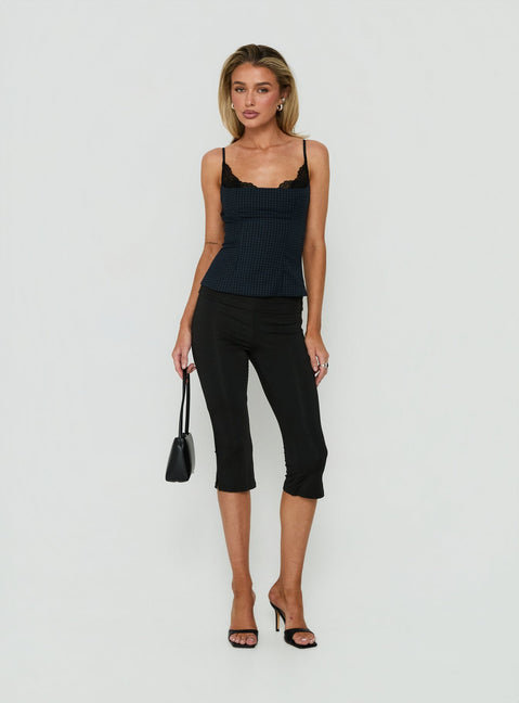 Featuring Avedon Foldover Waist Capri Pants in Black womens regular pants with high-rise detail view of model wearing Princess Polly