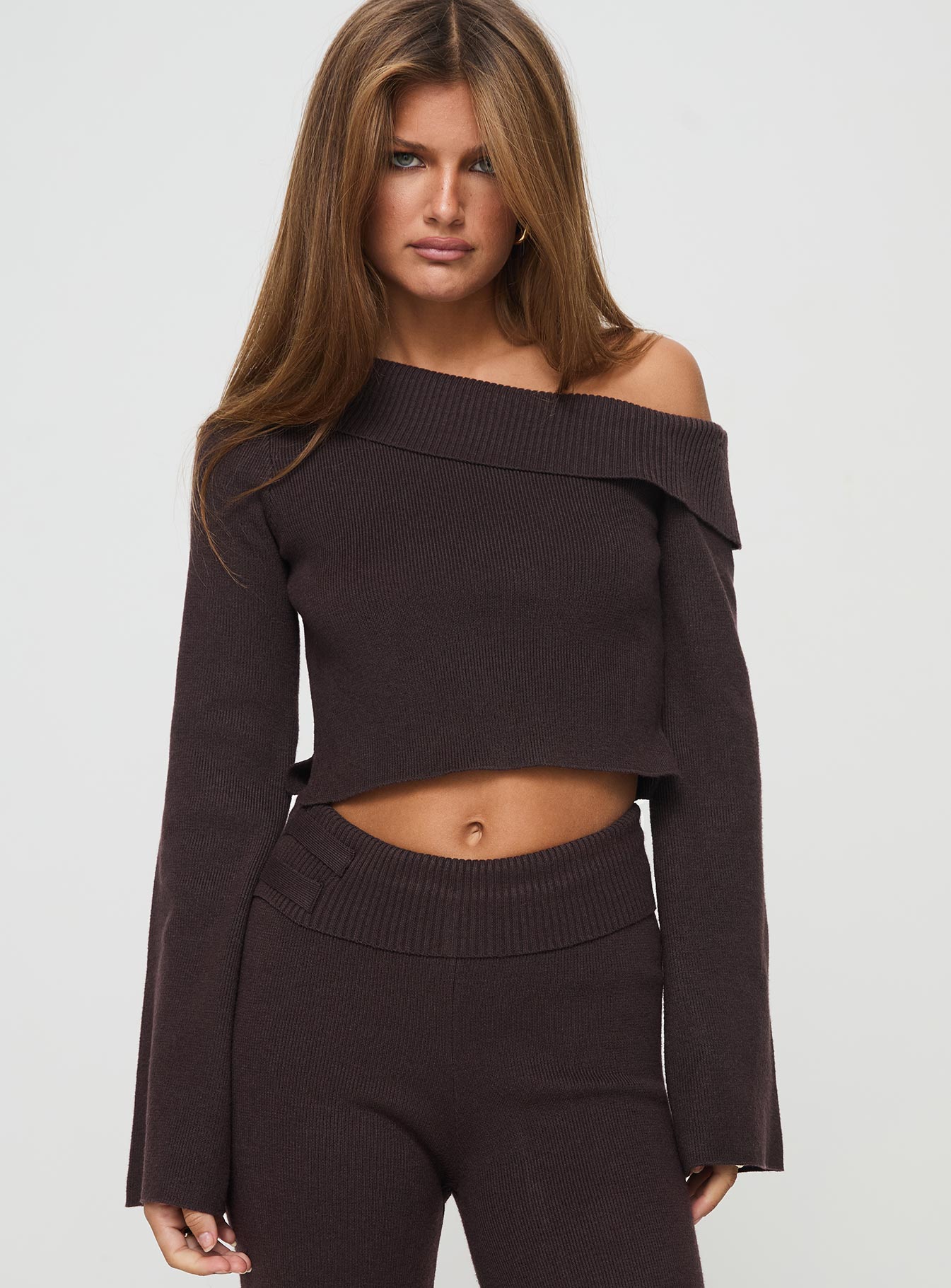 front view of model wearing Princess Polly Sina Off The Shoulder Top Chocolate Tall Full Sleeves Asymmetric Neckline 
