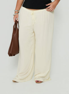 Featuring Finesse Pants Yellow Curve womens-regular-pants with mid-rise detail view of model wearing