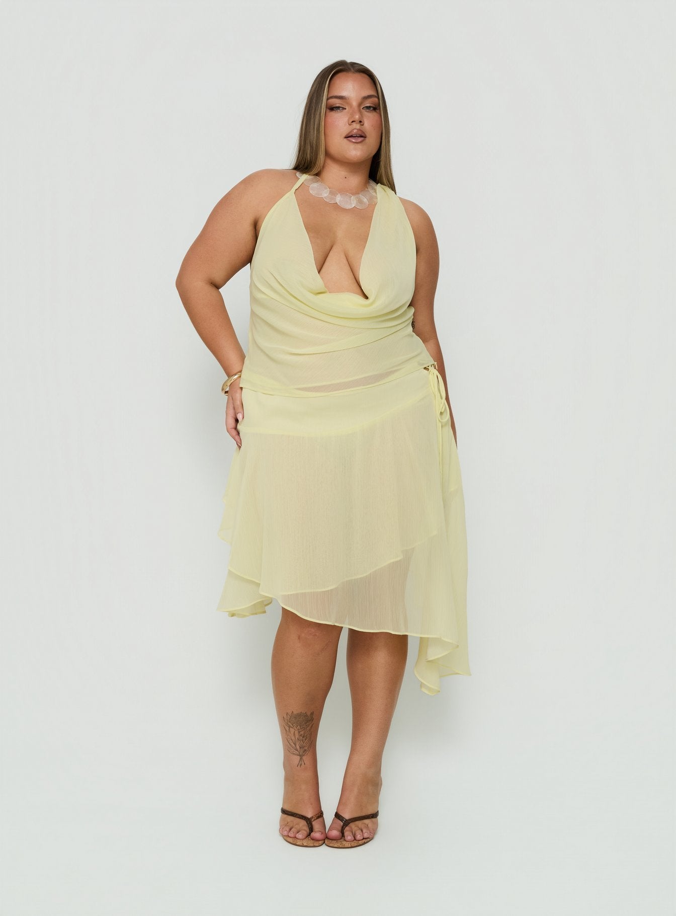 Showcasing the Evaleine Asymmetrical Chiffon Midi Skirt Baby Yellow Curve womens-skirts in midi length product Princess Polly