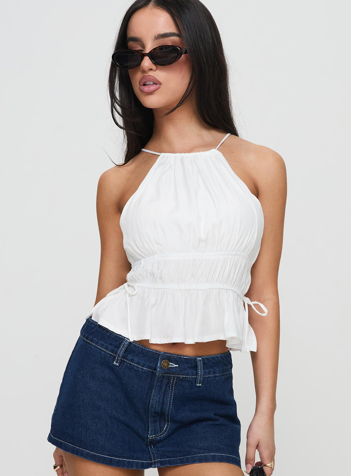 side view of model wearing Princess Polly Rozier Top White Sleeveless Crew Neck 