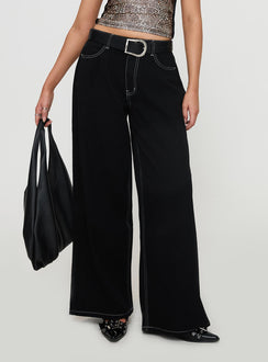 back view of model wearing Princess Polly Naylor Wide Leg Jeans Mid Black High Waisted 