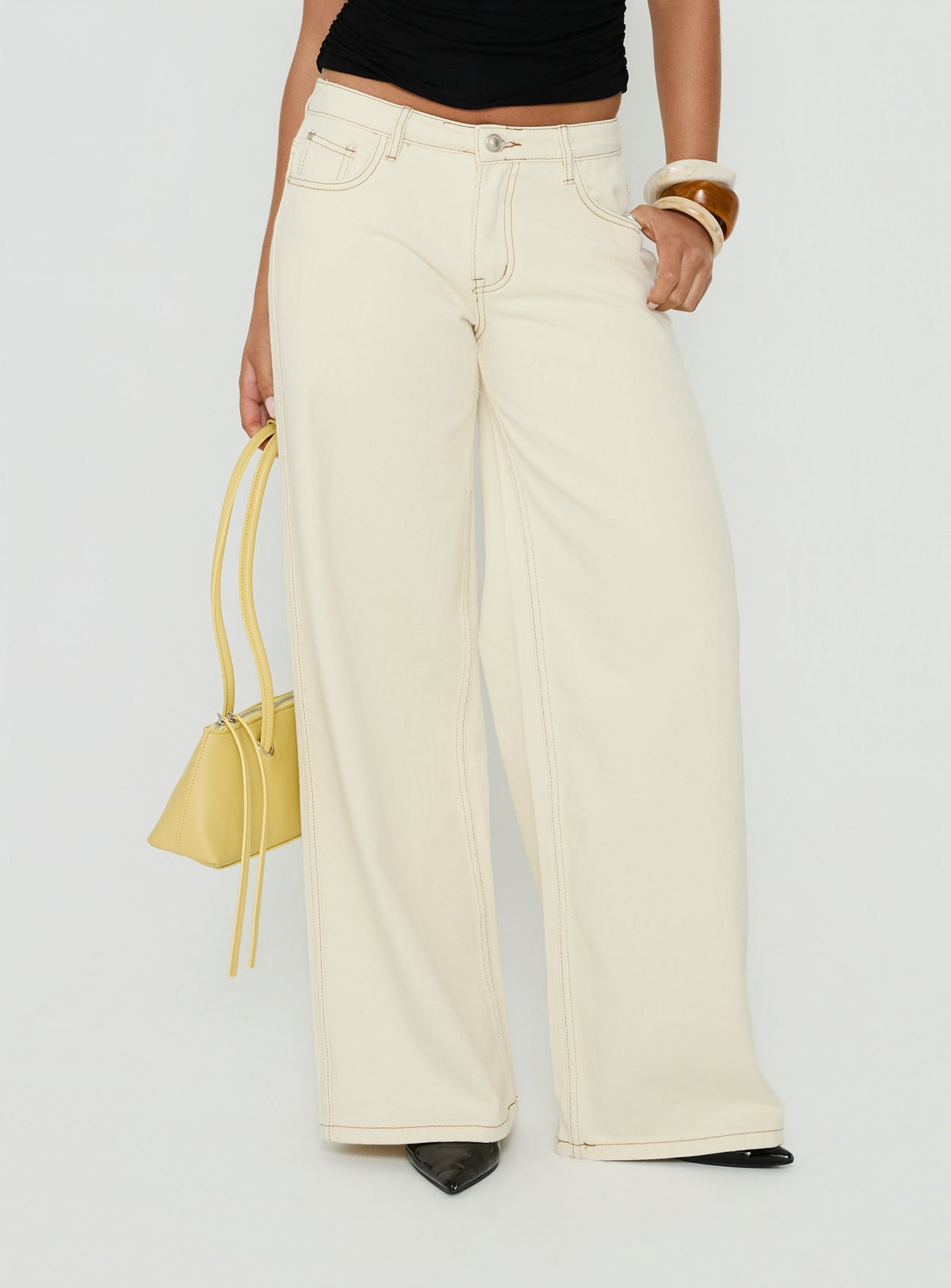 Featuring the Ramos Low Rise Wide Leg Jeans Cream in womens jeans with low-rise waist detail Princess Polly