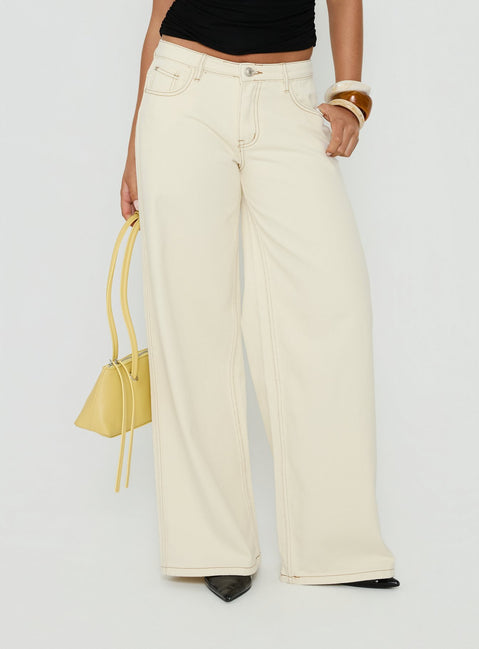 Featuring the Ramos Low Rise Wide Leg Jeans Cream in womens jeans with low-rise waist detail Princess Polly
