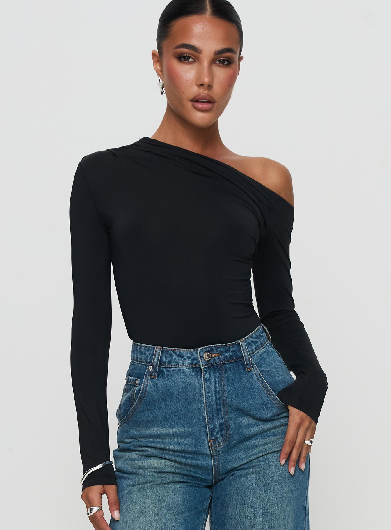front view of model wearing Princess Polly Antilles One Shoulder Bodysuit Black Full Sleeves 