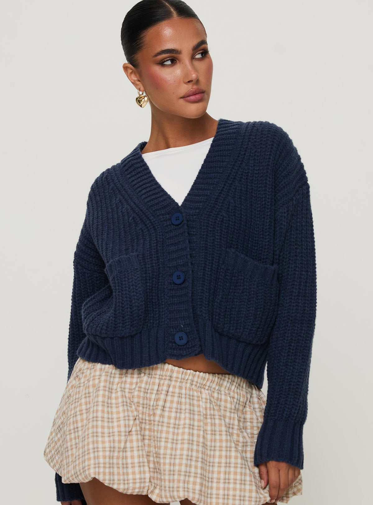 front view of model wearing Princess Polly Osias Cable Knit Cardigan Navy Cropped Jumpers 