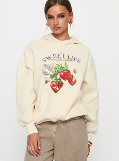 front view of model wearing Princess Polly Sweet Life Graphic Sweater Cream Long 