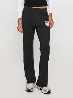 front view of model wearing Princess Polly Track Star Pants Black Low Rise Pants 