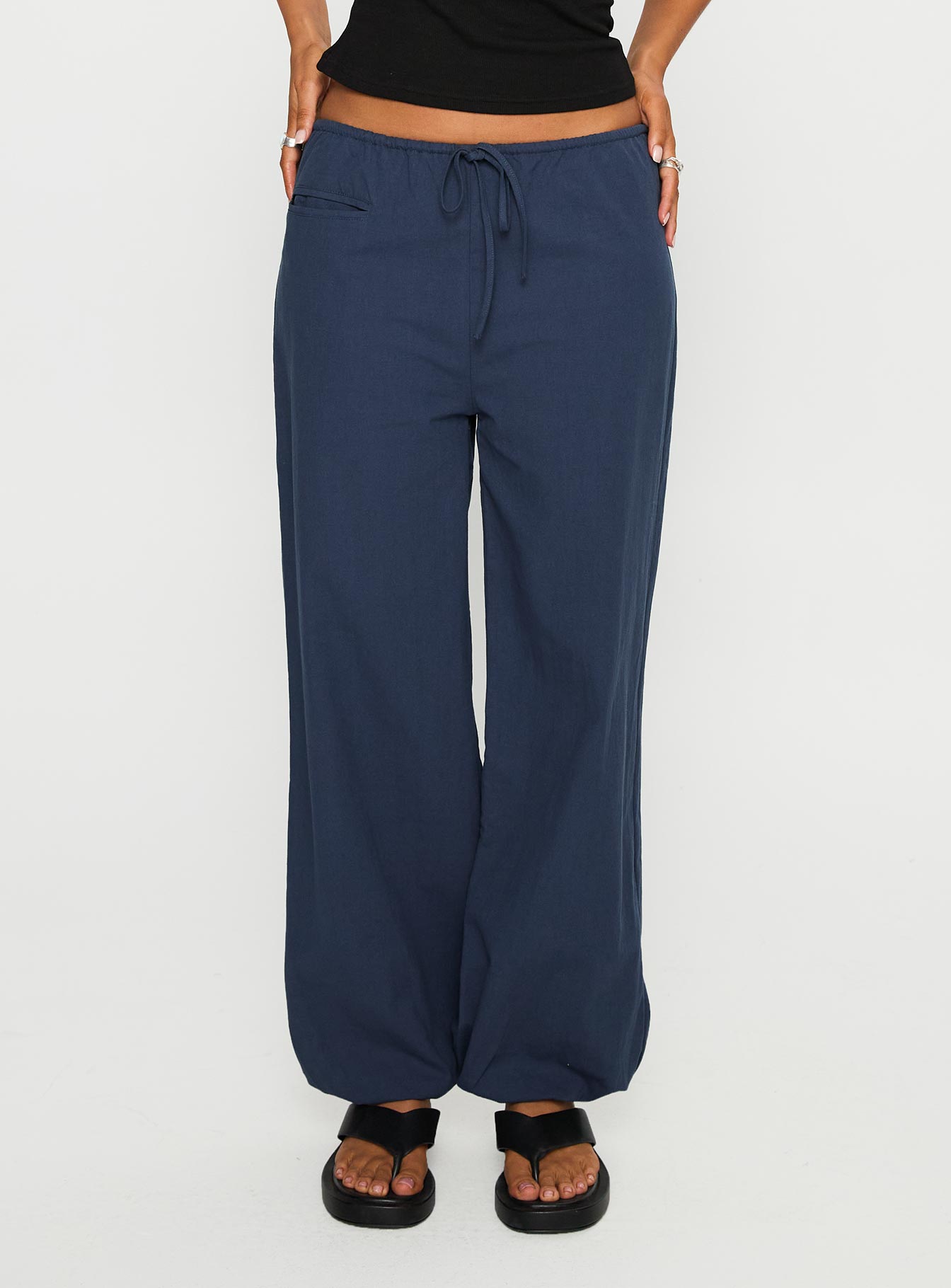 back view of model wearing Princess Polly Zodie Low Waist Pants Navy Low Rise Pants 