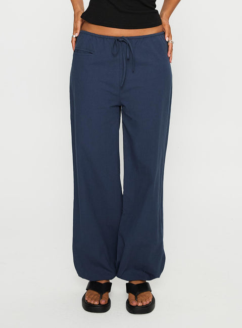 back view of model wearing Princess Polly Zodie Low Waist Pants Navy Low Rise Pants 