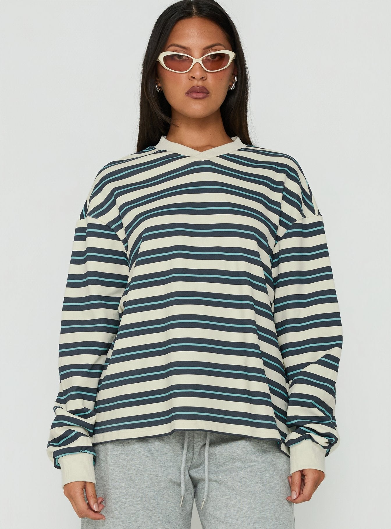 Featuring the Opollo V Neck Jumper in Blue Multi Stripe womens-jumpers with oversized fit and long sleeves front view of model wearing Princess Polly