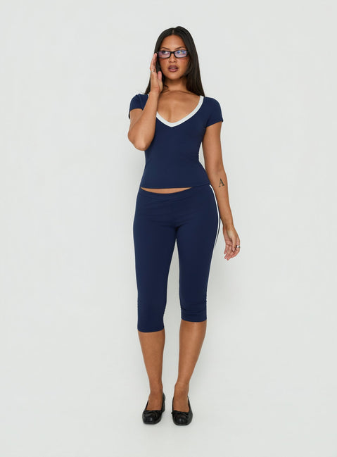 Showcasing Rowanna Sporty Capri Pants Navy / Cream womens-regular-pants with high-rise on-body view of model wearing