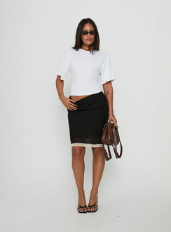 Discover the Shoreline Midi Skirt Noir in womens-skirts with fitted a-line silhouette showcasing midi length and lace hem details front view of model wearing Princess Polly