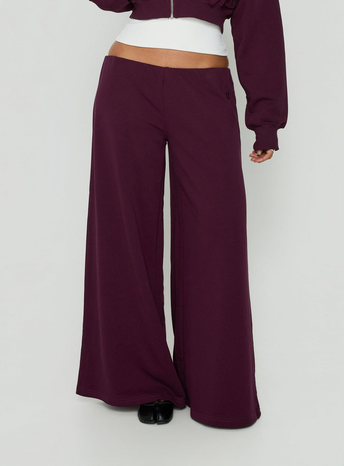 Featuring Kaeya Fleece Wide Leg Low Rise Pants in Plum womens-regular-pants front view of model wearing Princess Polly