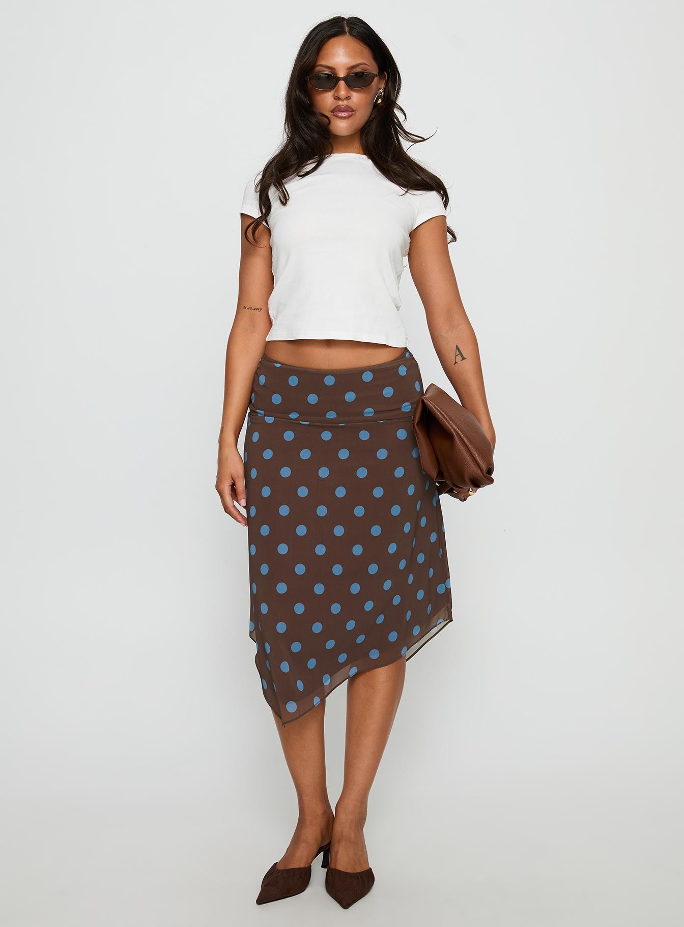   front view of model wearing Princess Polly Daphene Asymmetrical Midi Skirt Brown / Blue Polka Dot Midi Skirts 