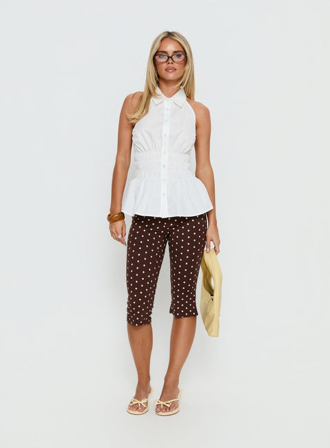 side view of model wearing Princess Polly Samaira Capri Pant Brown Polka Dot Mid Rise Pants Pants 