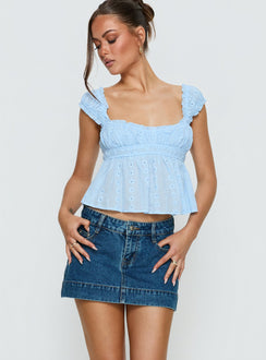   front view of model wearing Princess Polly Warna Low Rise Denim Mini Skirt Mid Blue Wash Mini Skirts 