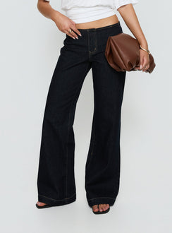 Featuring Buenos No Waist Low Rise Straight Leg Jeans Raw Denim Petite womens-jeans with belt and gold stitching front view of model wearing Princess Polly