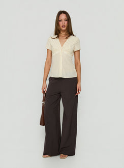 Discover Mericana Low Rise Wide Leg Pants in Brown womens regular pants with low-rise waist side view of model wearing Princess Polly