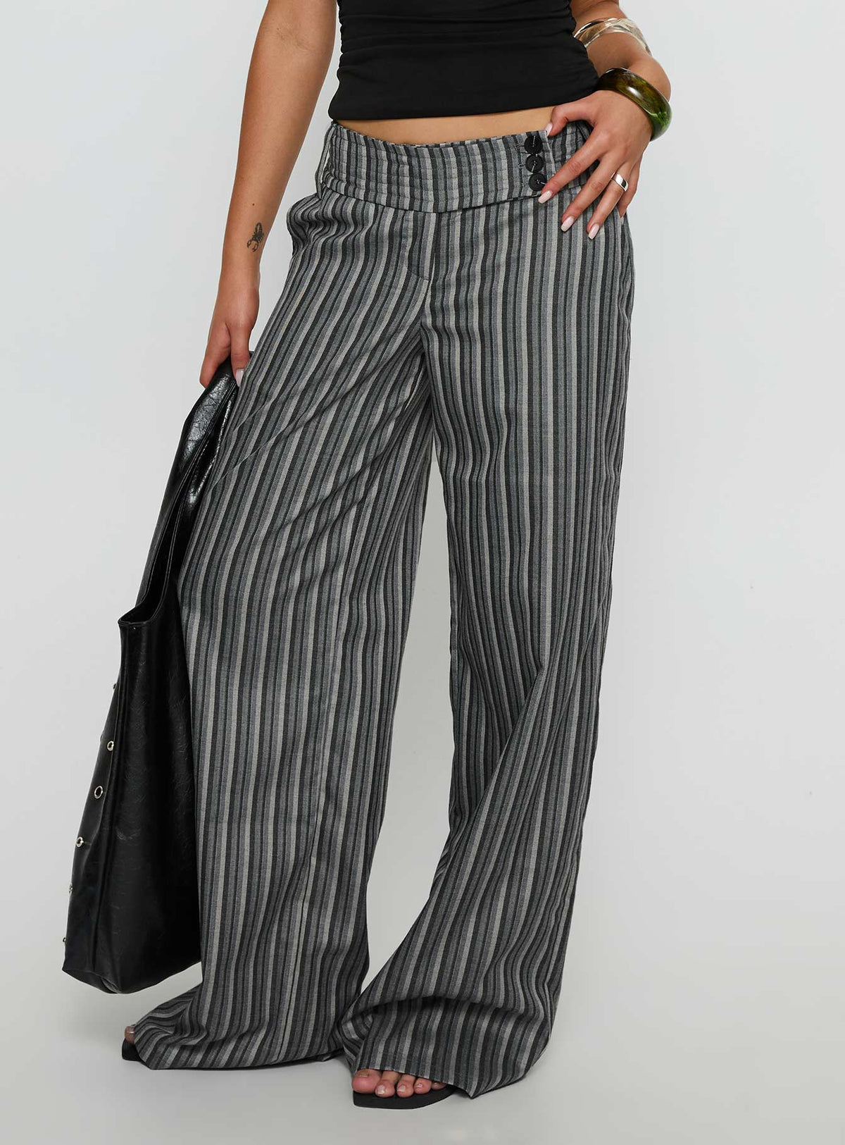 back view of model wearing Princess Polly Cedars Low Rise Pant Grey Stripe Low Rise Pants 