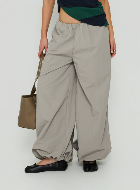 Featuring the Your Orbit Nylon Baggy Pants Grey womens-regular-pants with high-rise side view of model wearing