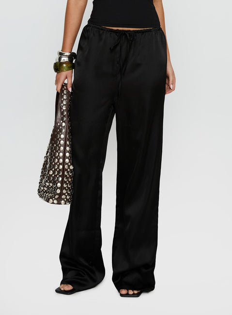 side view of model wearing Princess Polly Soulstar Satin Pants Black High Rise Pants 