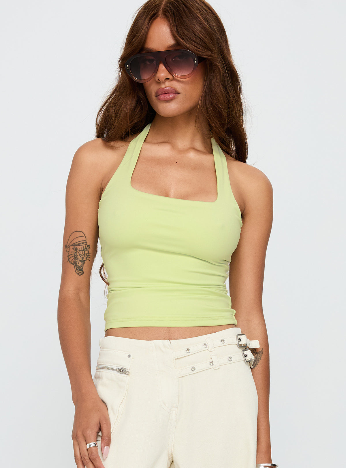 front view of model wearing Princess Polly Assumptions Halter Top Sage Sleeveless Square Neck 