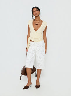 front view of model wearing Princess Polly Roda Anglaise Longline Shorts White Mid Rise Pants 