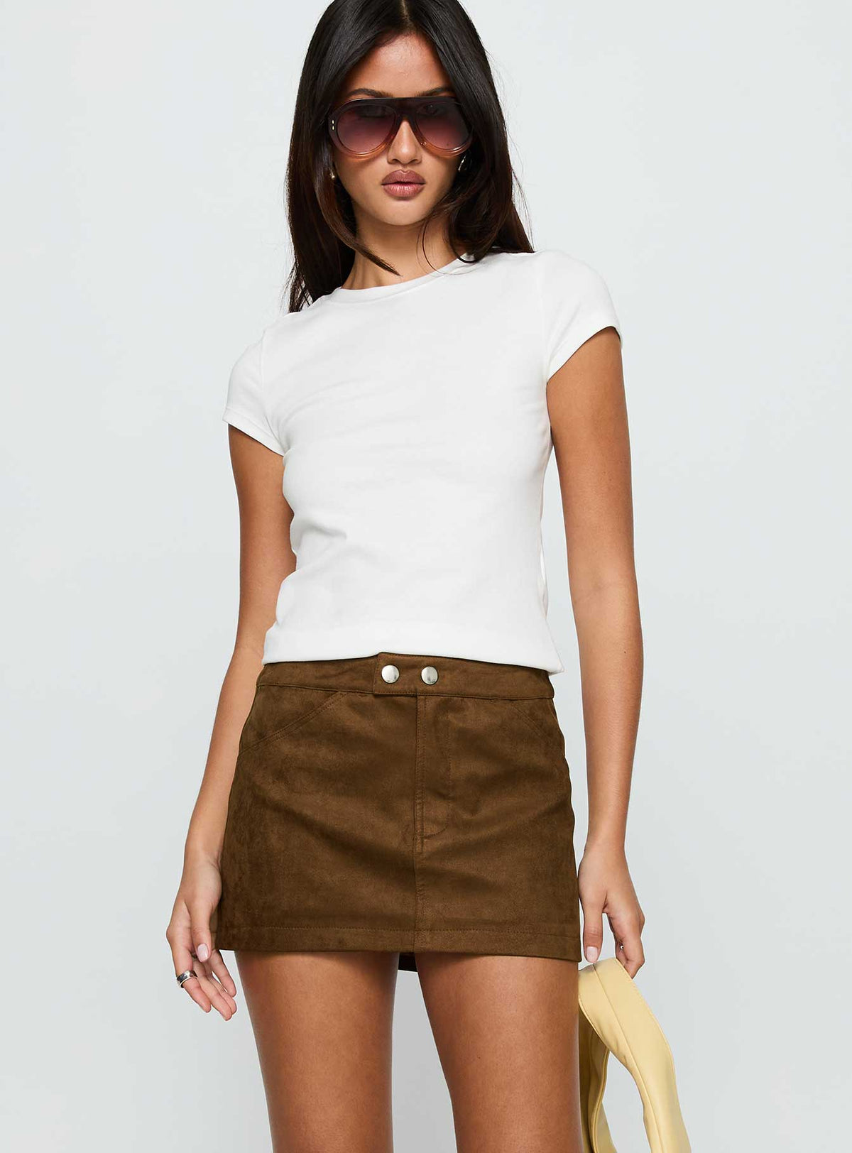   side view of model wearing Princess Polly Rhodeo Mini Skirt Brown Mini Skirts 