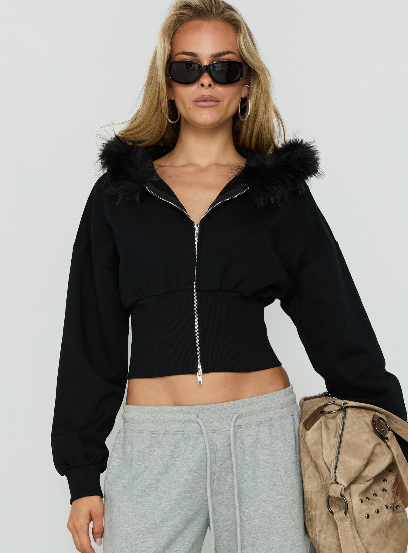 Designed with the Ramonda Faux Fur Hooded Jumper Black womens-jumpers featuring short length detail view of model wearing Princess Polly