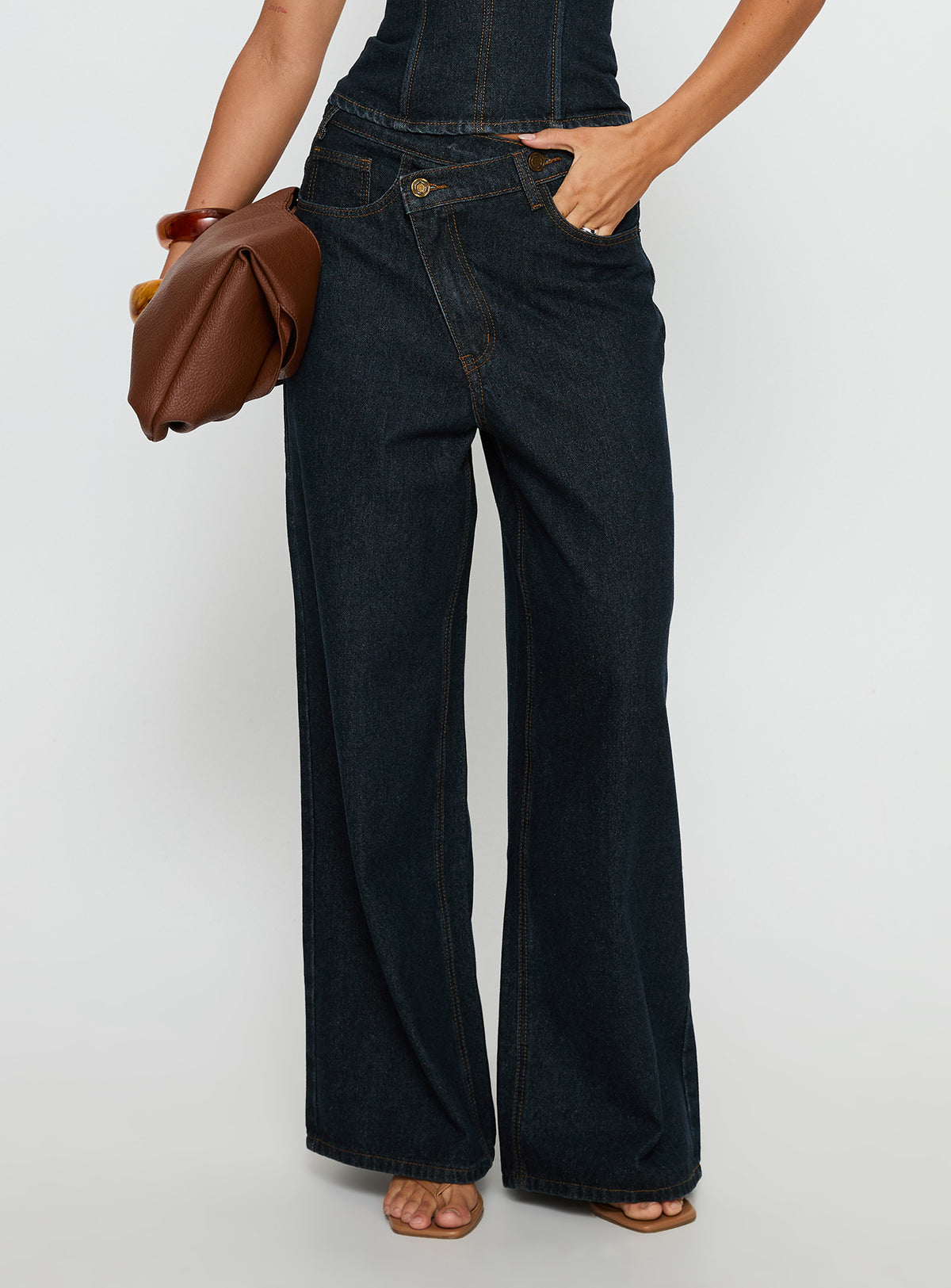 side view of model wearing Princess Polly Blue Crush Low Rise Wide Leg Jeans Indigo Mid Rise Jeans 