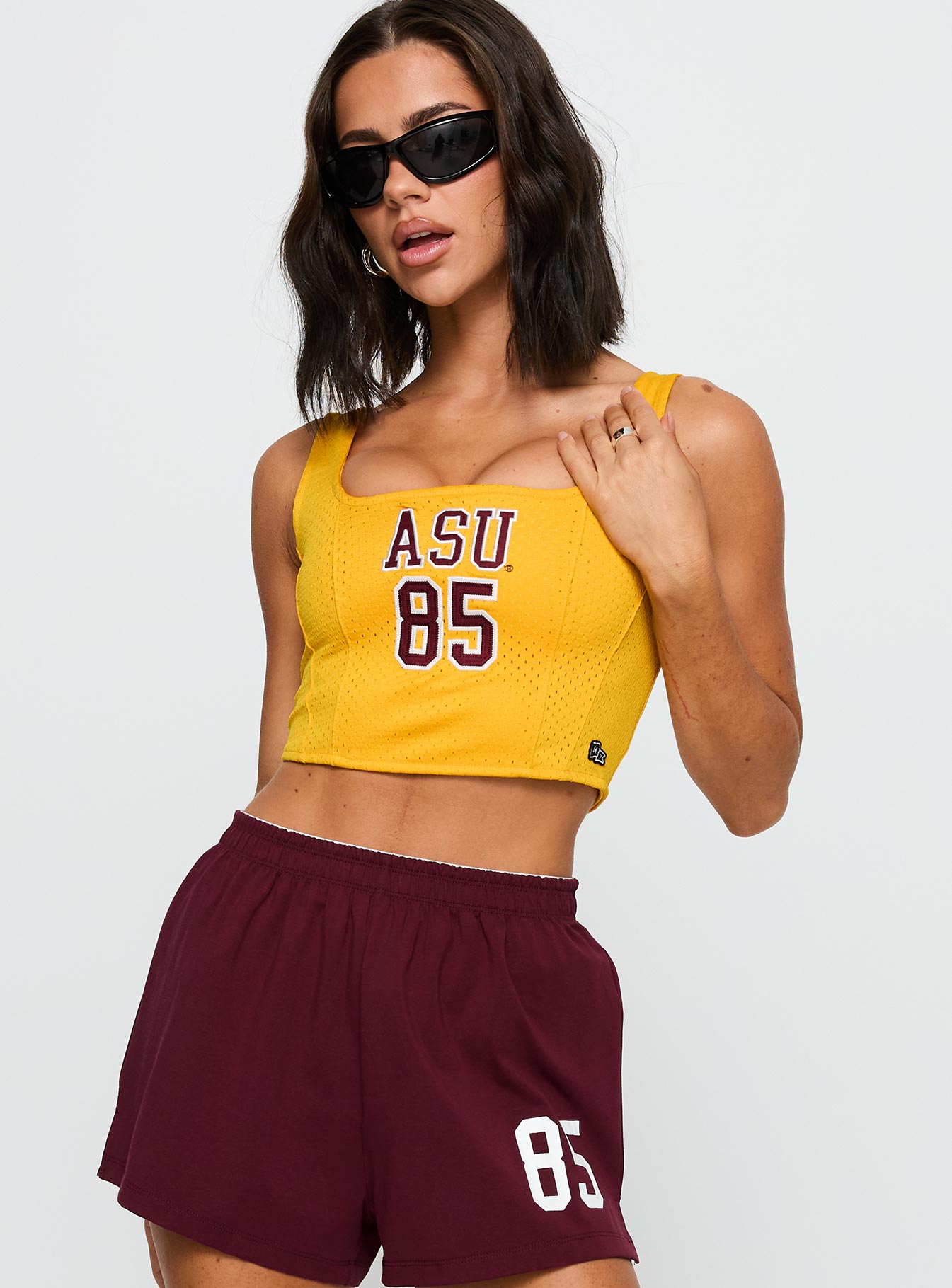 front view of model wearing Princess Polly ASU Jersey Corset Top Gold Sleeveless Square Neck 