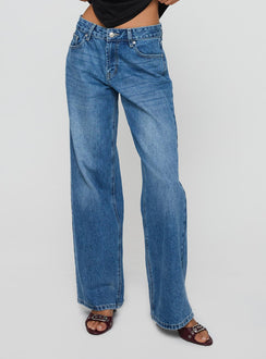 side view of model wearing Princess Polly Serenitia Mid Rise Relaxed Jeans Mid Blue Wash Tall Mid Rise 