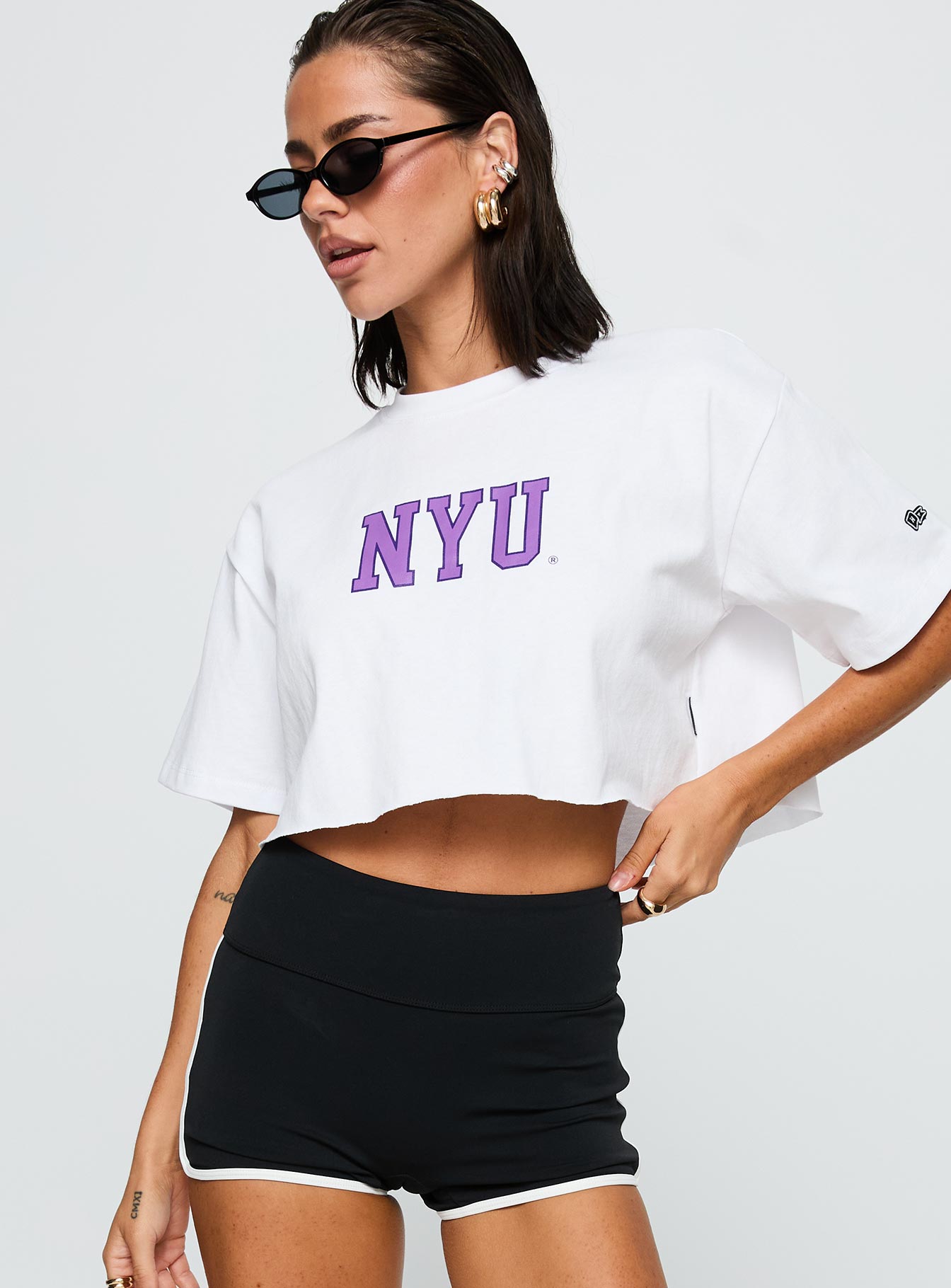 back view of model wearing Princess Polly Nyu Track Tee White Half Sleeves Crew Neck 