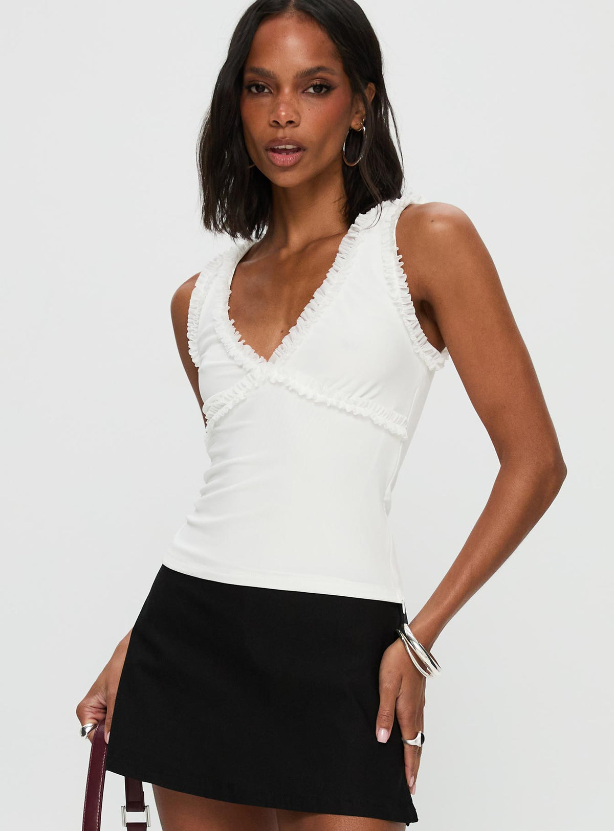side view of model wearing Princess Polly Danyia Frill Top White Sleeveless V-Neck 