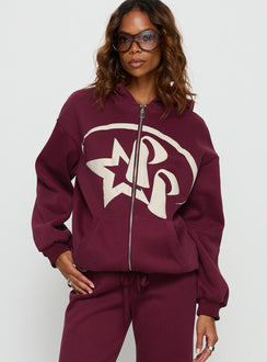 Designed with the Stargirl Zip Through Jumper in burgundy womens jumpers featuring long oversized fit, graphic print and hooded neckline detail view of model wearing Princess Polly