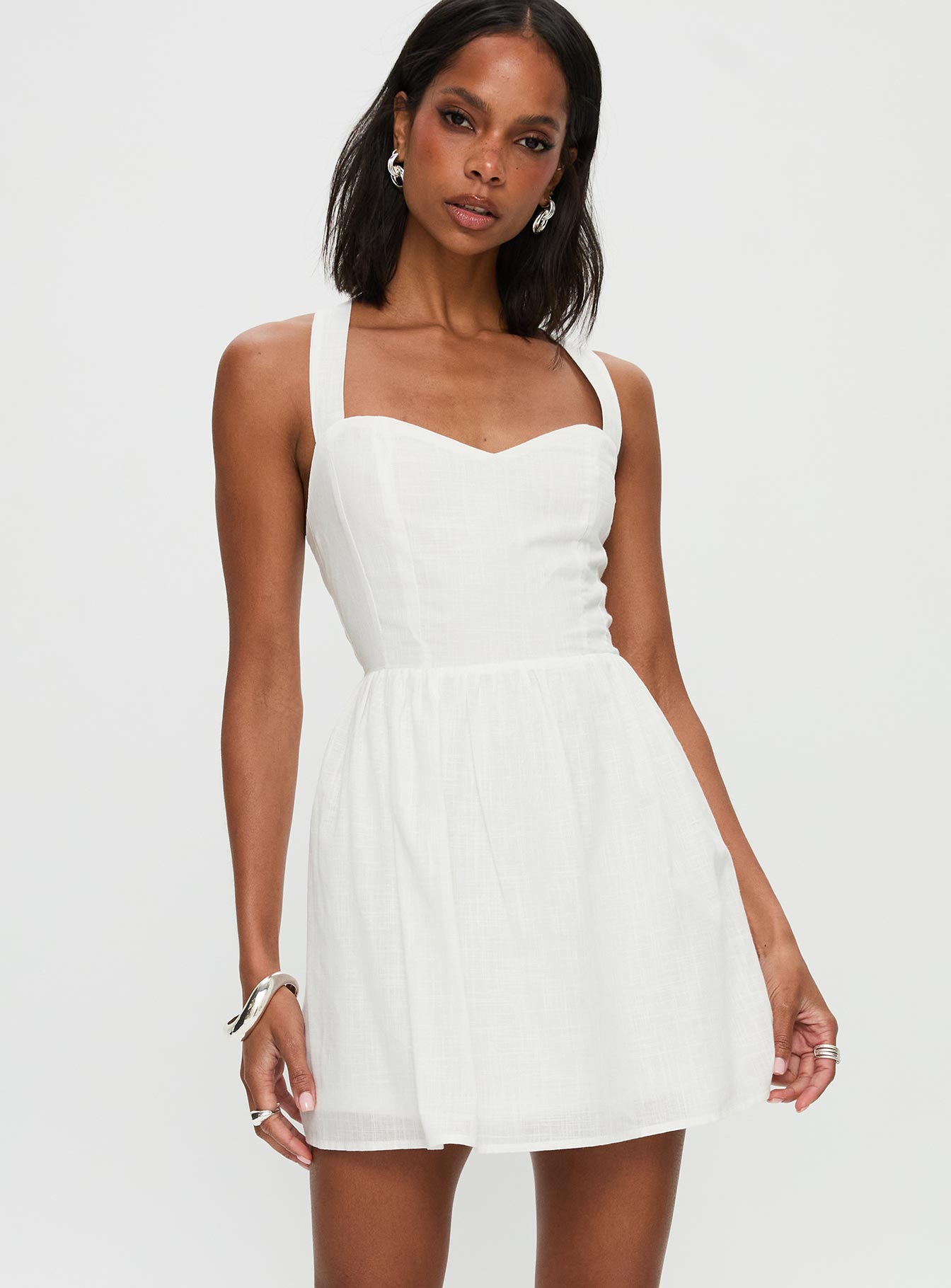 front view of model wearing Princess Polly Zolena Halter Mini Dress White Sweetheart Neckline 