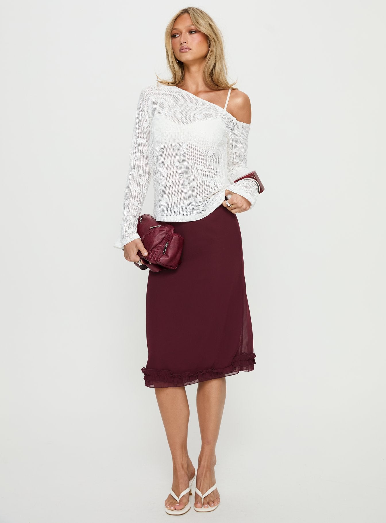   side view of model wearing Princess Polly Rosette Frill Midi Skirt Currant 