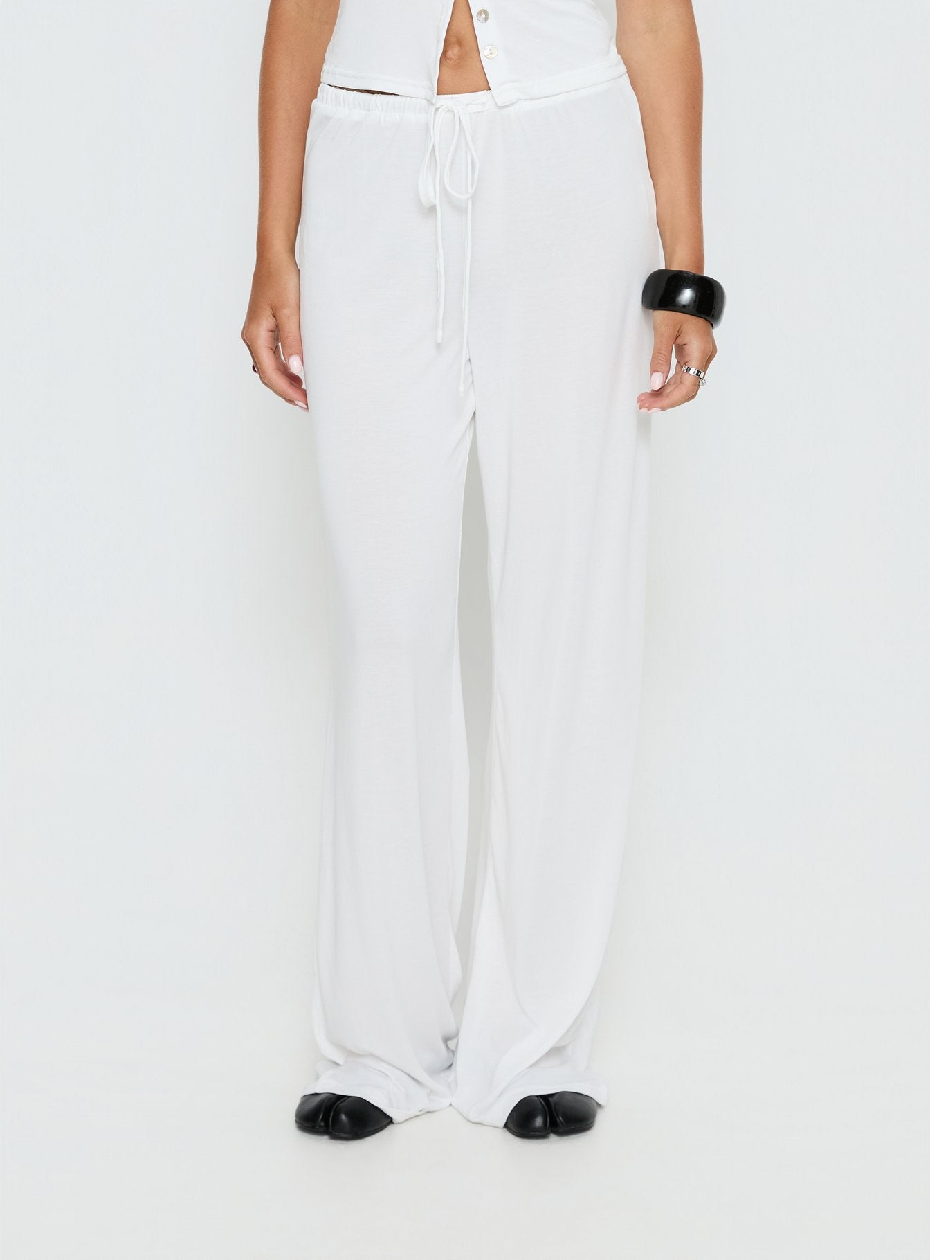 front view of model wearing Princess Polly Gavrielle Jersey Wide Leg Pants White Mid Rise Pants 