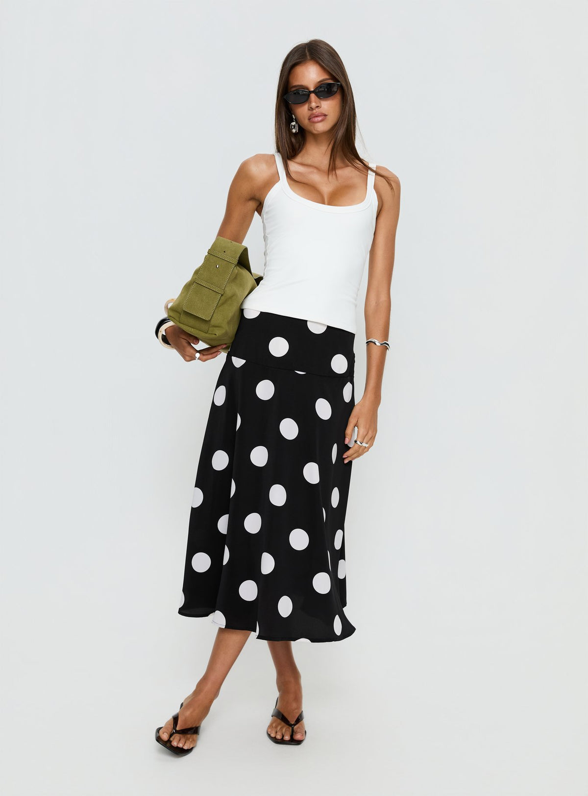   side view of model wearing Princess Polly Picture It Midi Skirt Black Polka Dot Midi Skirts 