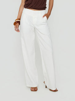 Crafted from linen, the Two Lovers Low Rise Pants in white with wide-leg cut and regular fit, detail view of model wearing
