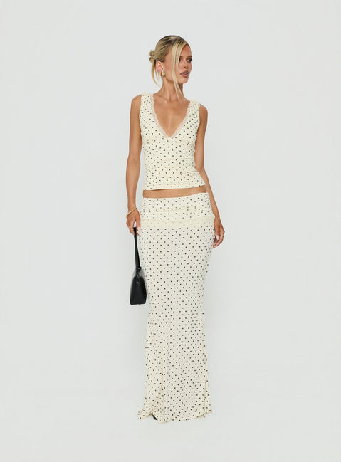 Crafted from jersey fabric the Zespri Maxi Skirt in Cream Polka Dot for womens-skirts with fitted a-line shape and lace hem front view of model wearing Princess Polly