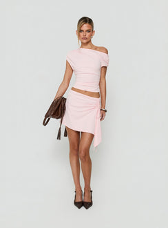 Showcasing the Vesperra Ruched Midi Skirt Pink womens-skirts in mini length front view of model wearing Princess Polly