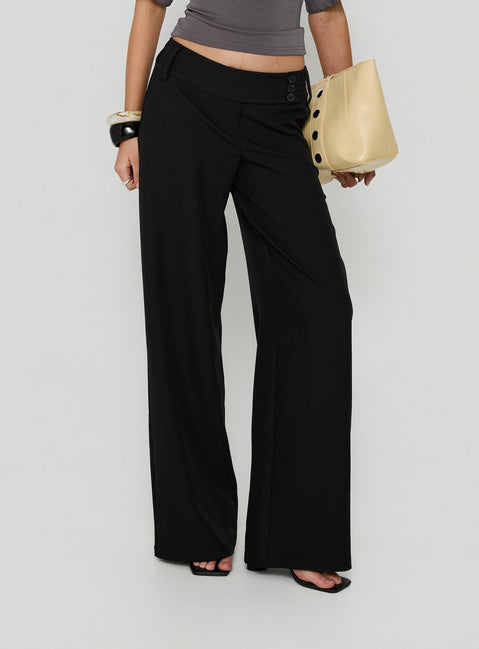 Showcasing the Cedars Low Rise Pant Black womens-regular-pants with low-rise detail view of model wearing