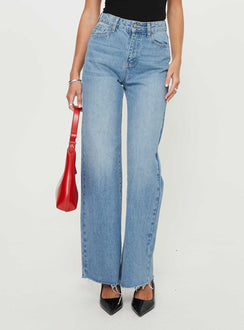 front view of model wearing Princess Polly Henesey Raw Hem Jeans Mid Wash Tall High Waisted 