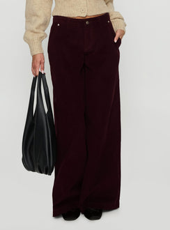 side view of model wearing Princess Polly Jacynda Low Waist Wide Leg Corduroy Jeans Currant Mid Rise Jeans 