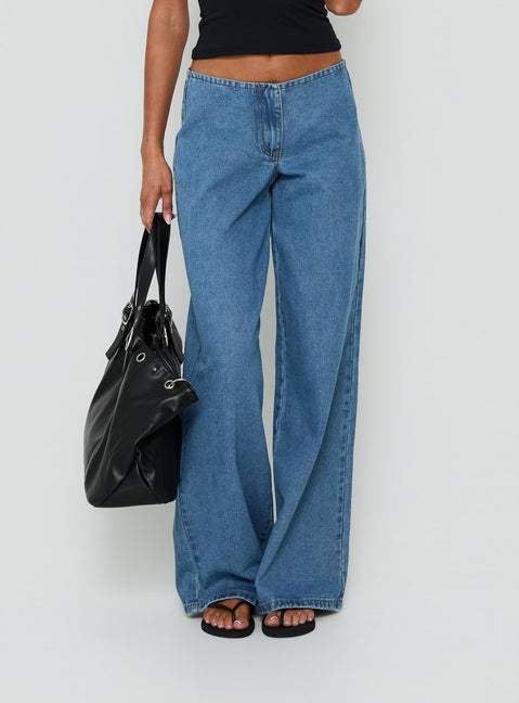 Featuring the Hereos Mid Rise Baggy Leg Jeans in Bright Blue Wash, womens jeans designed with mid-rise waist and belt, product Princess Polly