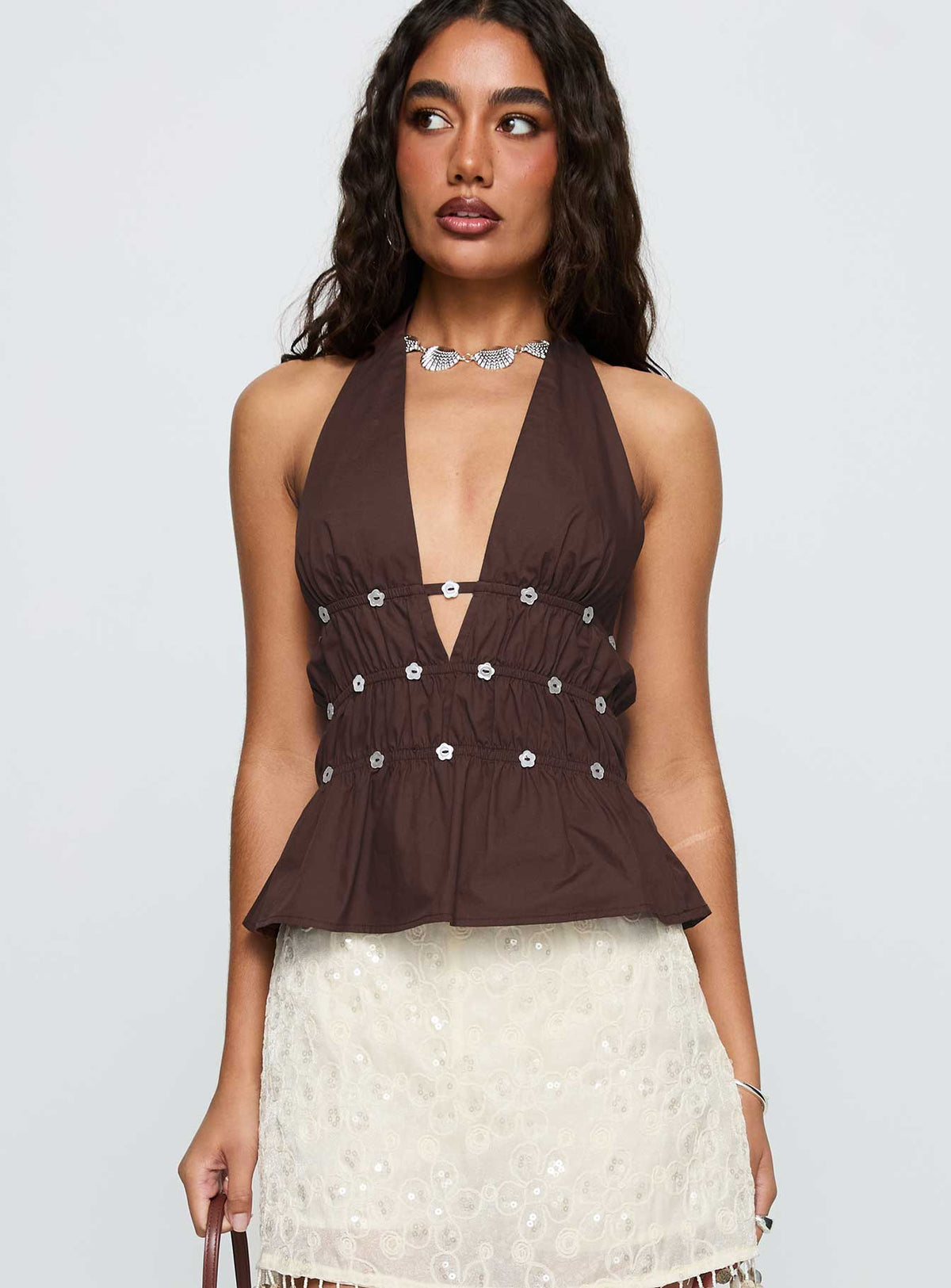 side view of model wearing Princess Polly Movies End Halter Top Brown Sleeveless Plunger 