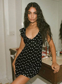 side view of model wearing Princess Polly I Guess So Mini Dress Black Polka Dot Tall V-Neck 