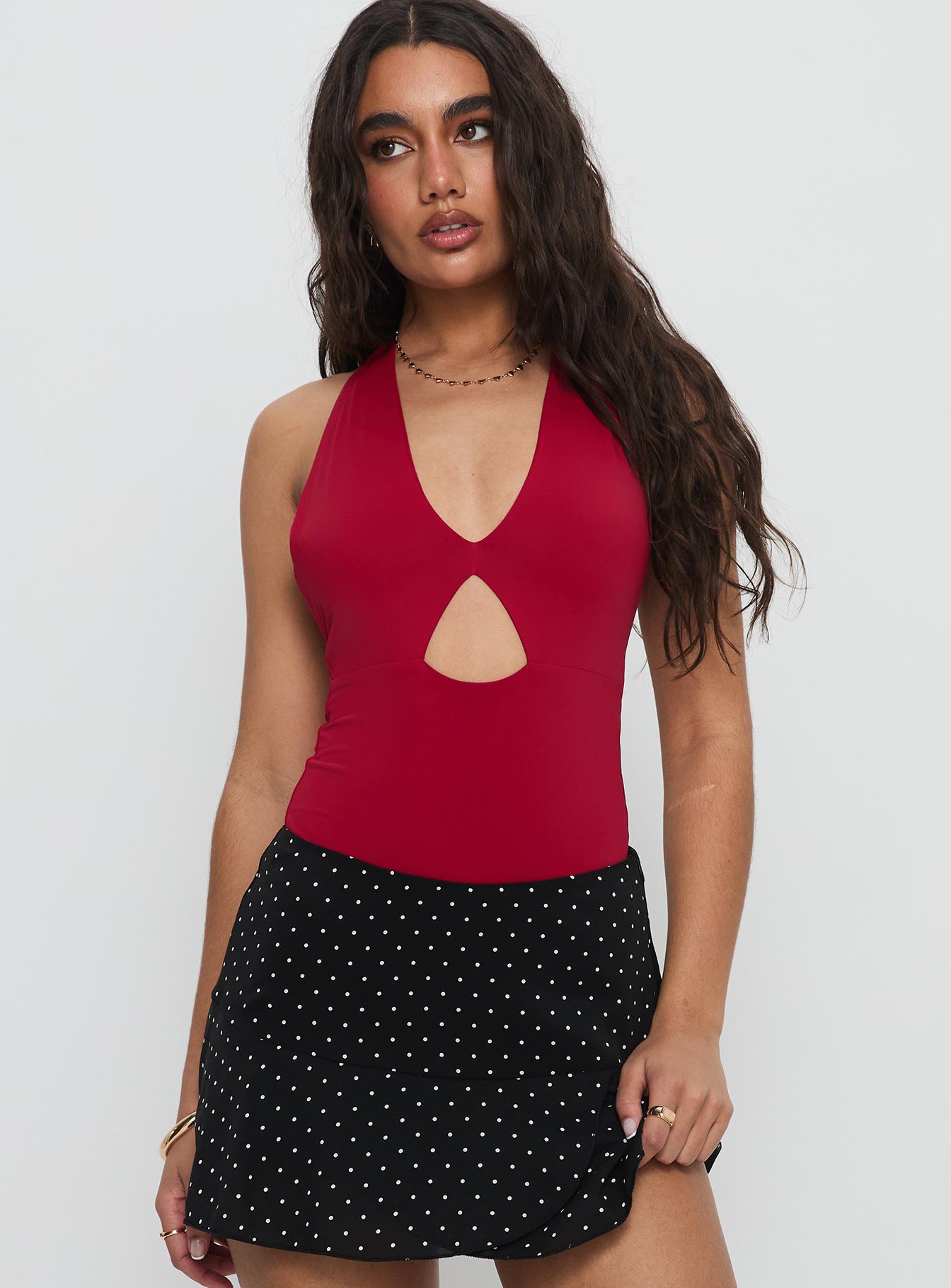 front view of model wearing Princess Polly Sugarberry Cut Out Bodysuit Red Sleeveless Bodysuit 